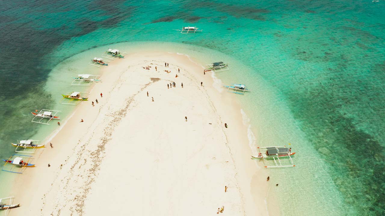 Aerial view of Naked Island white sandbar in Siargao, Philippines - private tri-island tour