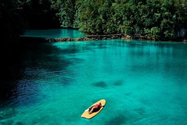 Turquoise waters of Sugba Lagoon with wooden diving platform, Siargao South Land Tour Philippines