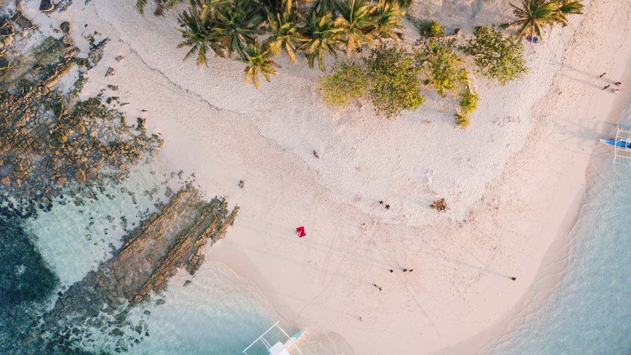 Aerial view of Siargao island hopping with turquoise water and white sandbar, Philippines